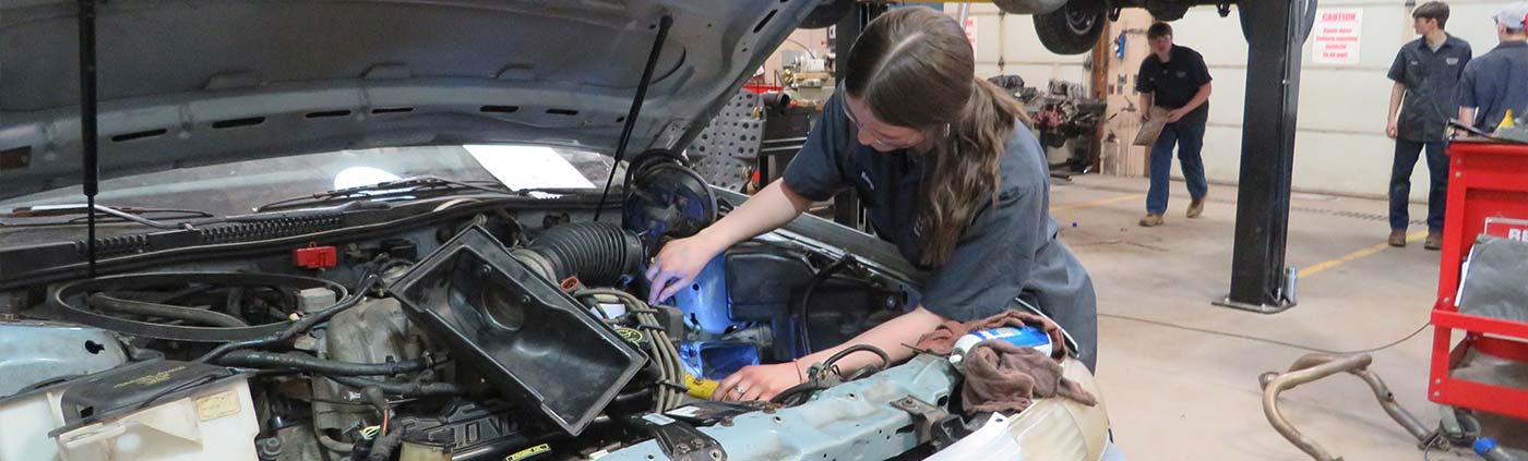 auto shop training student working on car engine in clarion county, pa