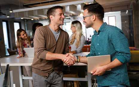 handshake between two business people in a casual setting